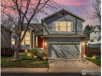 Charming two-story home features a well-maintained lawn, a two-car garage, and beautiful exterior paint at 5551 E 130Th Dr, Thornton, CO 80241