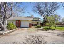 Charming single-story home with a one-car garage and well-maintained front yard at 1209 Centaur Cir # B, Lafayette, CO 80026