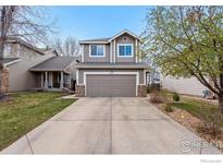 Charming two-story home features a spacious driveway and attached two-car garage at 6774 St Vrain Ranch Blvd, Firestone, CO 80504