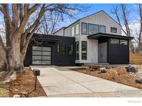 Striking modern home featuring a black brick facade, light siding, and contemporary architectural design at 2860 Table Mesa Dr, Boulder, CO 80305