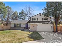 Inviting two-story home with a well-maintained lawn and attached two car garage at 7203 S Cody Way, Littleton, CO 80128
