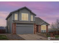 Charming two-story home featuring a well-maintained yard and an attached two-car garage at 16645 W 2Nd Ave, Golden, CO 80401