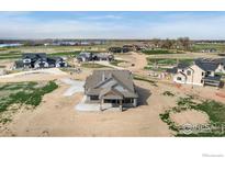 Expansive aerial view of a new construction home in a beautiful rural community at 1920 Country Dr, Frederick, CO 80504