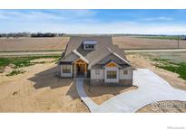Stunning home showcasing modern design, natural wood accents, and meticulous landscaping at 1920 Country Dr, Frederick, CO 80504