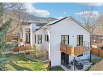 Bright, modern home with a lovely outdoor deck and lush backyard situated against a mountain backdrop at 3962 Promontory Ct, Boulder, CO 80304