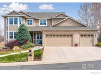 Charming two-story home with a three-car garage and well-maintained landscaping at 13680 Fall Creek Cir, Broomfield, CO 80020