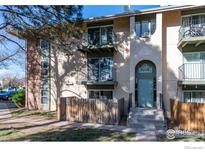 Charming condo building with balconies and well-maintained landscaping at 12102 Melody Dr # 103, Denver, CO 80234