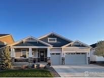Charming single Gathering home with a two-car garage and covered front porch at 1916 High Plains Dr, Longmont, CO 80503