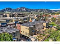 Stunning aerial view of community showcasing mountain views, lush landscaping, and modern architecture at 3215 Foundry Pl # 106N, Boulder, CO 80301