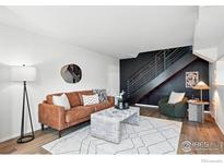Inviting living room with stylish decor, wood floors, and a staircase at 3390 34Th St # B, Boulder, CO 80301