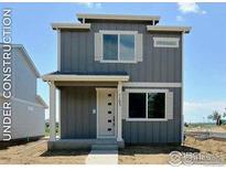 Charming two-story home with modern gray siding, white trim, and covered front porch at 1039 Spartan Ave, Berthoud, CO 80513