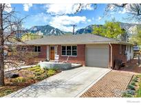 Charming brick home featuring a well-maintained yard with views of the mountains at 195 S 35Th St, Boulder, CO 80305