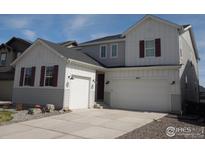Charming two-story home with a two-car garage, white siding, and a well-maintained front yard at 3672 Outcrop Ct, Castle Rock, CO 80108