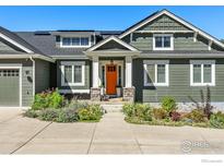Charming home featuring an inviting entrance, beautiful landscaping, and a well-maintained facade at 7531 Spring Dr, Boulder, CO 80303