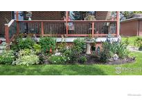 Charming home with well-maintained front garden and a cozy front porch at 2226 Judson St, Longmont, CO 80501