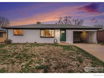 Charming ranch-style home featuring a freshly painted exterior and an attached carport at 2566 S Stuart St, Denver, CO 80219