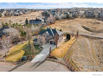 Stunning two-story home featuring a spacious yard, mature trees and a charming curb appeal in a desirable neighborhood at 14958 Wistera Way, Broomfield, CO 80023