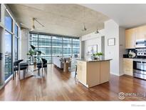 Bright open floor plan with large windows showcasing city views and modern decor at 1700 Bassett St # 1303, Denver, CO 80202