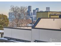 Striking city skyline view from rooftop terrace provides an inviting and modern outdoor space at 3150 Vallejo St, Denver, CO 80211