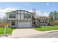 Charming home featuring a well-manicured lawn and a two-car garage at 4223 Peach Way, Boulder, CO 80301