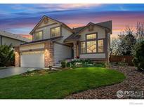 Inviting two-story home boasting well-maintained landscaping and a two-car garage at 1320 Indian Paintbrush Ln, Longmont, CO 80503