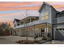 Beautiful, modern exterior showcasing covered porches, garages, and appealing architectural details at sunset at 267 Clementina St, Louisville, CO 80027