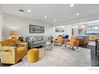 Bright living room features modern furniture, neutral colors, and open floor plan at 3825 Northbrook Dr # F, Boulder, CO 80304
