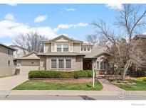 Charming two-story home with a manicured front yard and brick accents at 903 Northern Way, Superior, CO 80027