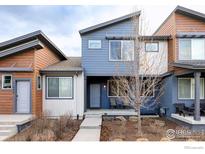 Charming two-story home featuring a modern design and inviting entrance at 11488 E 25Th Dr, Aurora, CO 80010