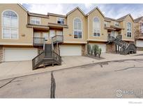 Inviting townhomes feature private garages, stairways, and charming architectural details at 1757 High Plains Ct, Superior, CO 80027