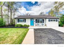 Charming single-story home with a well-manicured lawn, bright blue door and modern landscaping at 3483 S Glencoe St, Denver, CO 80222