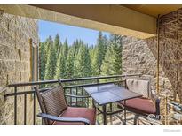 Balcony with forest view and a seating area at 755 Columbine Rd # 303, Breckenridge, CO 80424