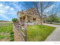 Charming two-story home with a well-manicured lawn and inviting curb appeal at 82 Rivera Ct, Erie, CO 80516