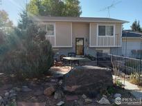 Charming two-story home with a well-maintained yard and decorative rock landscaping at 266 Wooster Ave, Firestone, CO 80520