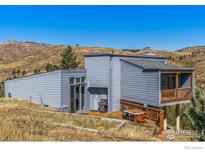 Stylish home with a spacious deck, offering outdoor living and scenic views at 319 Camino Bosque, Boulder, CO 80302