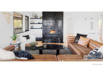 Charming living room featuring a modern fireplace, leather sofa, and stylish decor at 319 S Peak Rd, Boulder, CO 80302