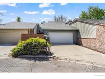 Charming home with a well-maintained lawn and a two-car garage, offering curb appeal at 4950 Sundance Sq, Boulder, CO 80301