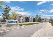 Exterior shot of Grace Place, a covenant protected community with beautiful landscaping and well maintained buildings at 6385 Oak St # 301, Arvada, CO 80004