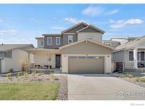 Charming two-story home with a well-manicured lawn and a two car garage in a Gathering-friendly neighborhood at 1312 Loraine S Cir, Lafayette, CO 80026