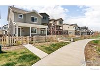 Charming street view showcasing well-maintained homes with inviting front yards and sidewalks at 320 Marshall Mews, Superior, CO 80027