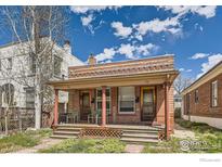 Charming brick duplex featuring a covered porch with seating, perfect for relaxing outdoors at 72 N Pennsylvania St, Denver, CO 80203