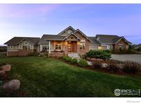 Attractive single Gathering home showcasing professional landscaping and exterior stone accents at 8392 Niwot Meadow Farm Rd, Niwot, CO 80503