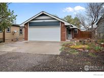 Charming single-story home with a two-car garage and well-maintained front yard at 130 Ash St, Hudson, CO 80642