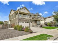 Charming two-story home featuring stone accents, an attached two-car garage, and a cozy, covered porch at 16060 Fairway Dr, Commerce City, CO 80022