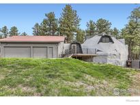 Unique dome home with garage and deck offering rustic charm and modern amenities at 387 Millionaire E Dr, Boulder, CO 80302