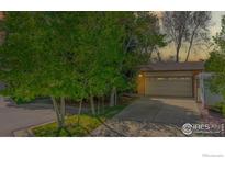 Charming home featuring a well-maintained exterior and a spacious two-car garage at 729 Jay Pl, Berthoud, CO 80513