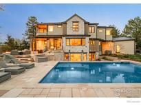 Gorgeous home showcasing a beautiful pool, patio, and stone accents at 2158 Tamarack Ave, Boulder, CO 80304