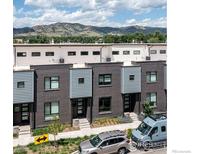Modern townhomes with brick facade and mountain views, featuring contemporary design and landscaping at 2907 32Nd St, Boulder, CO 80301