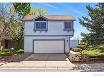 Charming two-story home features a front yard and a two-car garage at 3812 Howe Ct, Boulder, CO 80301