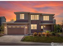 Beautiful two-story home featuring manicured landscaping, a two-car garage and picturesque sunset sky at 4780 W 108Th Pl, Westminster, CO 80031